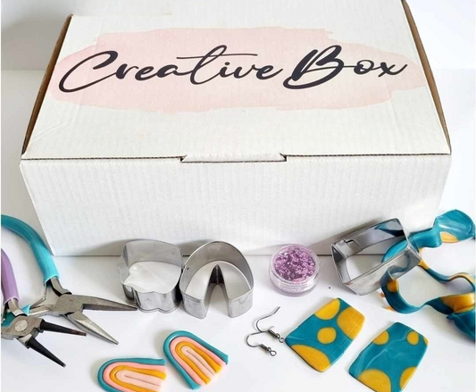DIY polymer clay earring making kit for one person with cutters, clay, roller, glitter, pliers, and earring hooks by Creative Box